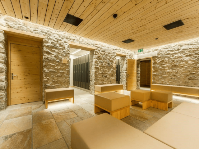 Stone and wood-accented ski locker room